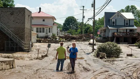 Getty Images Residents survey Clendenin, West Virginia after the Elk River overflowed on 25 June 2016