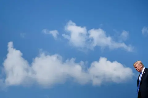 Getty Images Trump disembarks plane in Greenbrier Valley last year