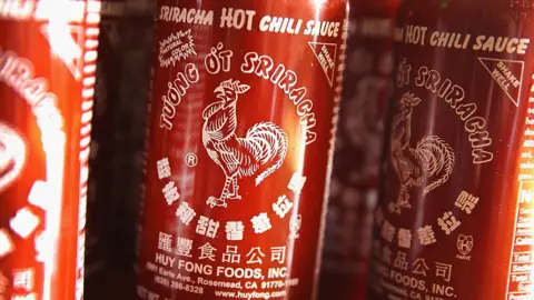 Getty Images Bottles of Sriracha hot chili sauce.