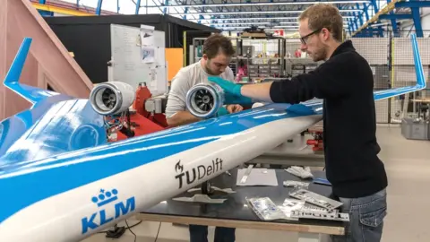 TU DELFT Engineers working on the Flying-V test aircraft