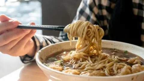 Getty Images Traditional soy sauce wonton noodles