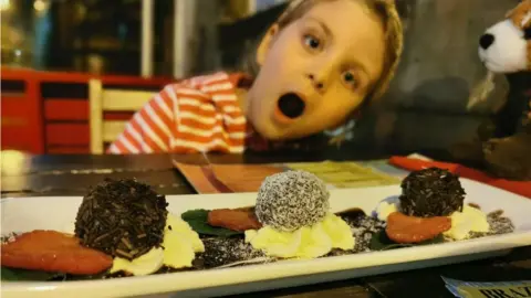 Daniel Davies-Luke Luna at a restaurant