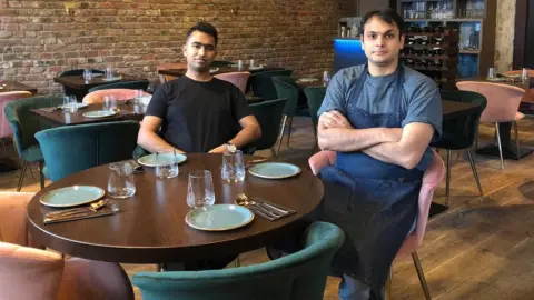 Republic Kuldeep Mattegunta and his business partner seated at their restaurant