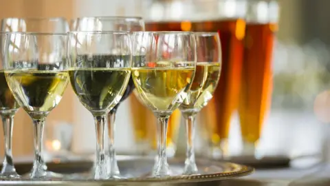 Getty Images Wine glasses and beer