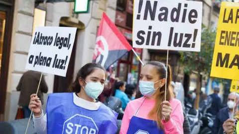 Getty Images Protesters hold placards during the demonstration. People held a protest against the increase of electricity prices in Madrid