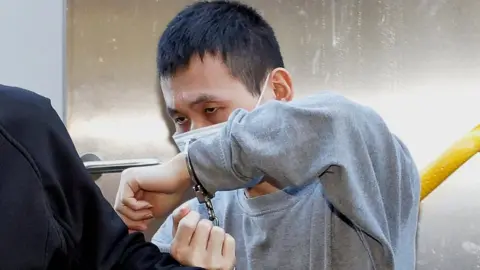 Dimitris Legakis/Athena Pictures Chun Xu arriving at Merthyr Tydfil Crown Court