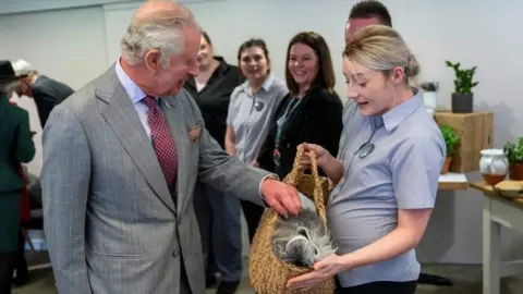Reuters Prince Charles is given a sheepskin rug