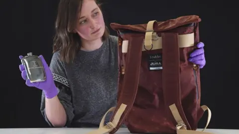 Stewart Attwood Laura Scobie with a backpack which forms part of the collection