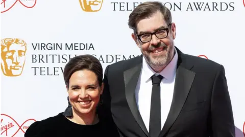 Getty Images Richard Osman pictured with partner Ingrid Oliver