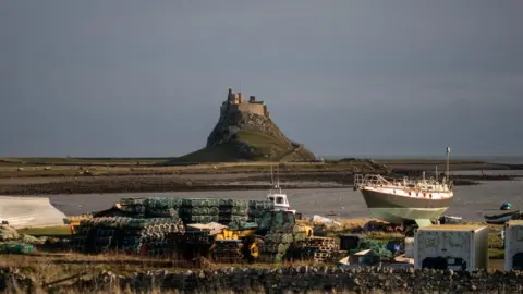Getty Images Fishing boats at Lindisfarne