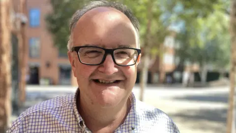 Robby West/BBC Prof Nick Talbot