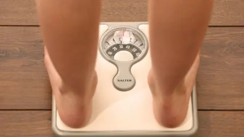 PA Media Feet on bathroom scales