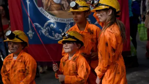 Reuters Children dressed as miners