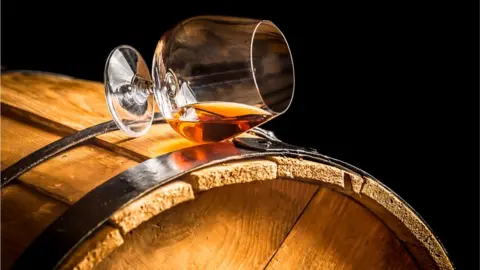 Getty Images Whisky glass and barrel