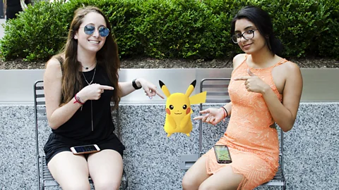 Socialfly Disha Singh and Rebecca Lipstein, interns at Socialfly, play Pokemon Go in New York City during their workday, with the boss's blessing. (Credit: Socialfly)