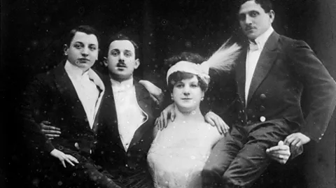 Library of the Congress Katie Sandwina, 'the Lady Hercules', holding up three men (Credit: Library of Congress)