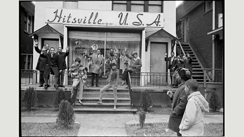 Library of Congress, from Motown: The Sound of Young America, Thames & Hudson With The Supremes, Berry Gordy hails members of the Motown house band, left, and his Holland-Dozier-Holland hitmakers in 1965