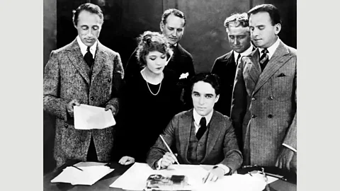 Getty Images The founding of United Artists on 17 April, 1919 (left to right in the foreground: DW Griffith, Pickford, Chaplin and Fairbanks) (Credit: Getty Images)