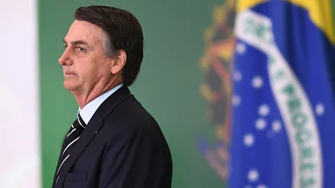 Getty Images President Jair Bolsonaro has proposed solutions to daycare inequality, but community mothers are still out of the conversation (Credit: Getty Images)
