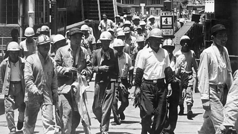Getty Images In the post-World War Two economic boom, gaman also came to refer to enduring long working hours amidst nation-building for an emerging middle class (Credit: Getty Images)