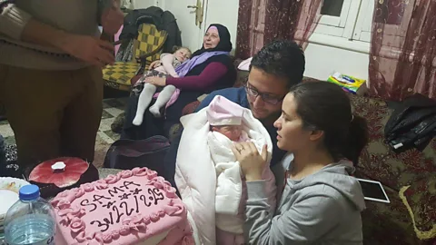 ITN The film balances footage of death and suffering with that of Al-Kateab muddling through life with her husband, daughter, and friends Salam and Afra (Credit: ITN)