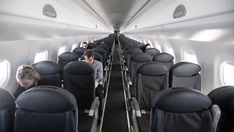 Getty Images An almost empty flight from Milan to London in March. Some airlines are moving to keep at least middle seats empty in aircraft that have them (Credit: Getty Images)