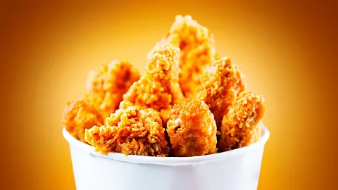 Wail Alameen/Getty Images "Colonel" Sanders adopted traditional African American cooking techniques to help catapult Southern-style fried chicken to worldwide fame (Credit: Wail Alameen/Getty Images)