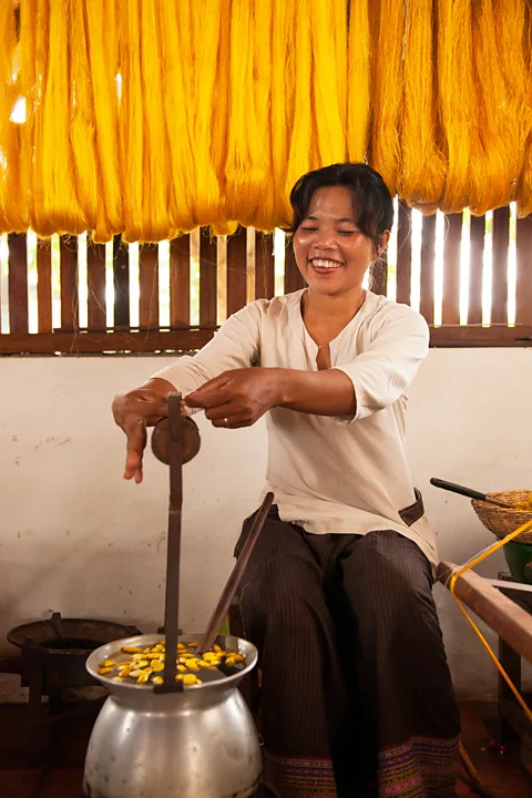 Golden Silk Pheach At Golden Silk Pheach, workers unravel silk from the cocoons and later spin it onto bobbins (Credit: Golden Silk Pheach)