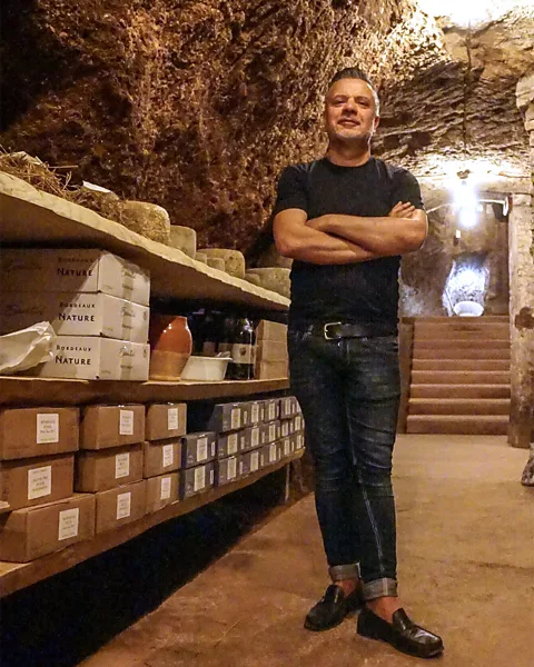 Marina Pascucci Massimo Innocenti stores pecorino in Necci dal 1924's 2,000-year-old cave (Credit: Marina Pascucci)