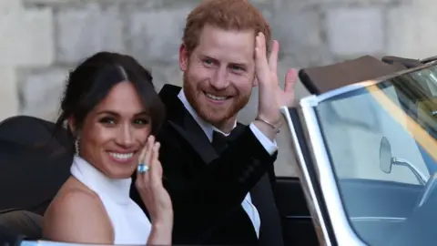 AFP Prince Harry and Meghan leave for their reception