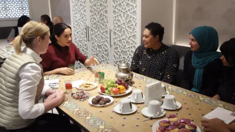 Getty Images Clare Smyth and Meghan Markle at Grenfell kitchen