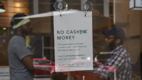 Getty Images No cash accepted sign at Sweetgreen