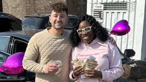 Patrick Glaz Zachery Dereniowski with Promys, who received a new MacBook, a new car and $50,000 cash from a crowdfund.